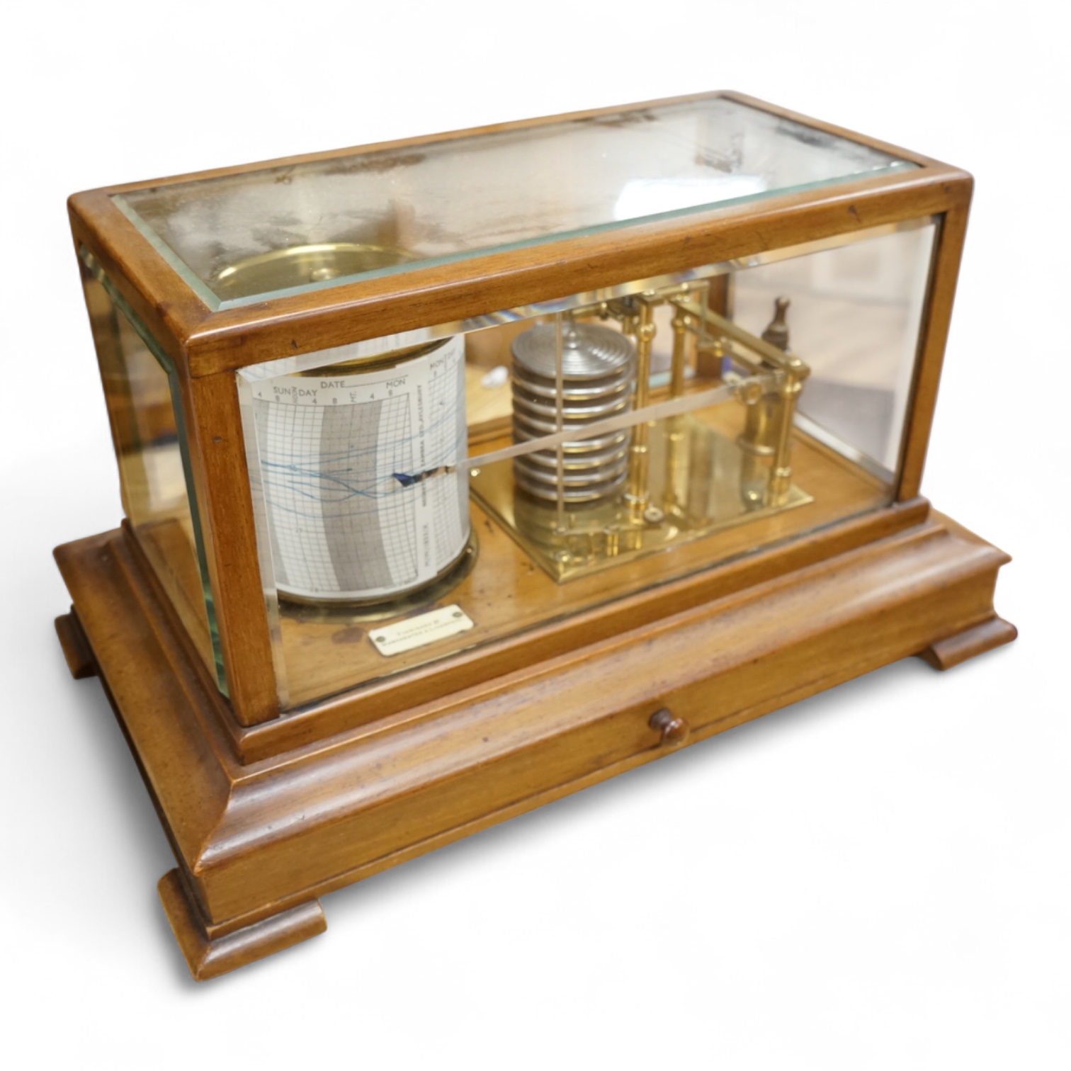 An early 20th century oak cased barograph by Finnigans Ltd., Manchester & Liverpool, with integral drawer underneath containing spare papers